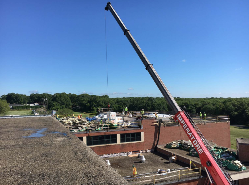 A view from the roof of Dartmouth Middle School, where a crane is being used to repair the roof. COURTESY DARTMOUTH PUBLIC SCHOOLS